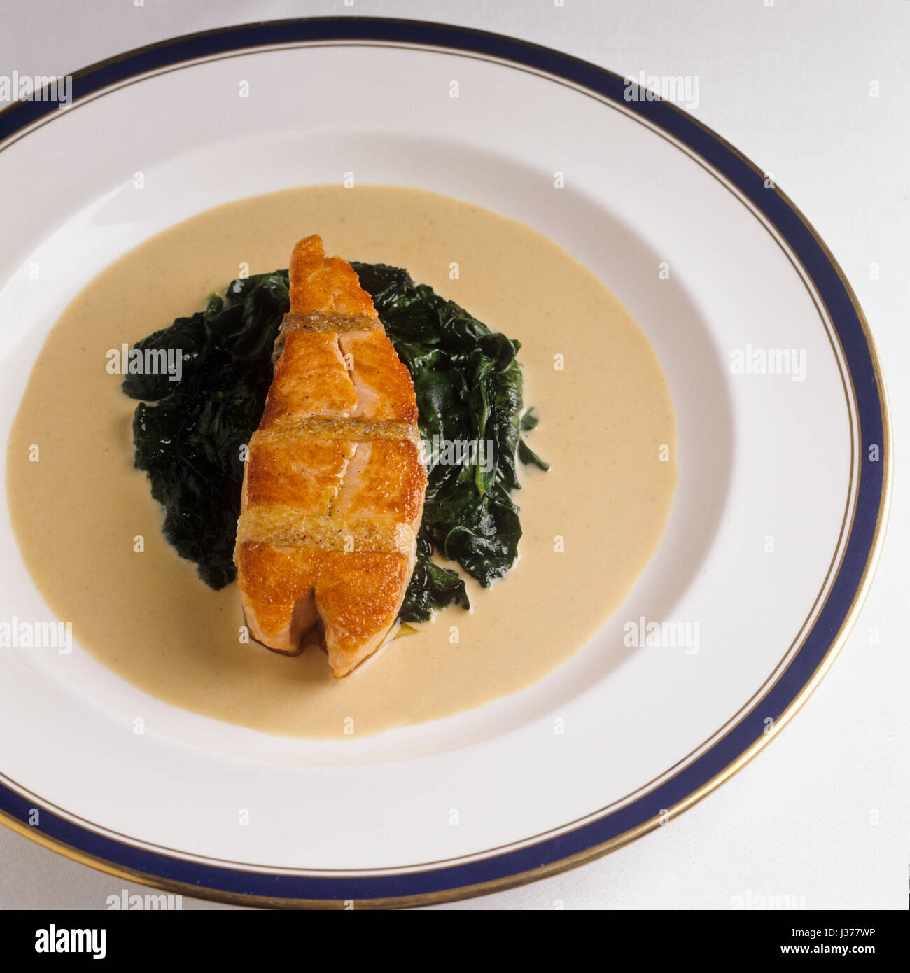 Dish with salmon and spinach. Stock Photo