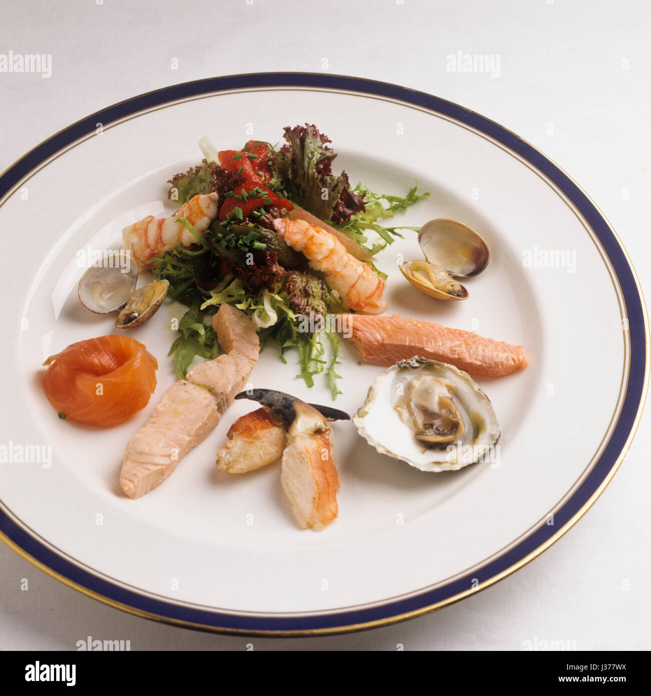 Assorted seafood and salad on plate. Stock Photo