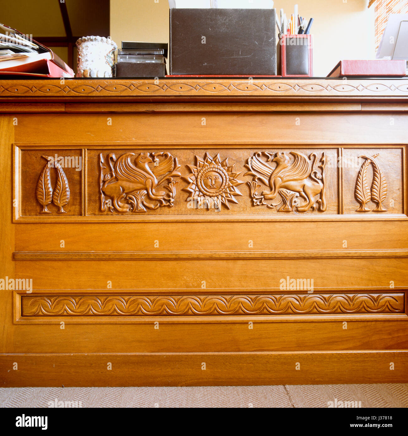 The front of carved wooden desk. Stock Photo