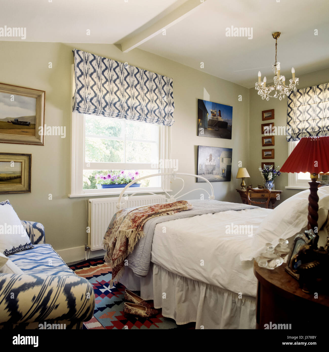 Bedroom with sash window. Stock Photo