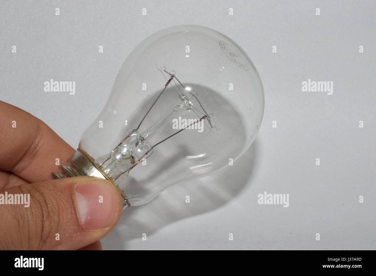 lightbulb in hand Stock Photo - Alamy
