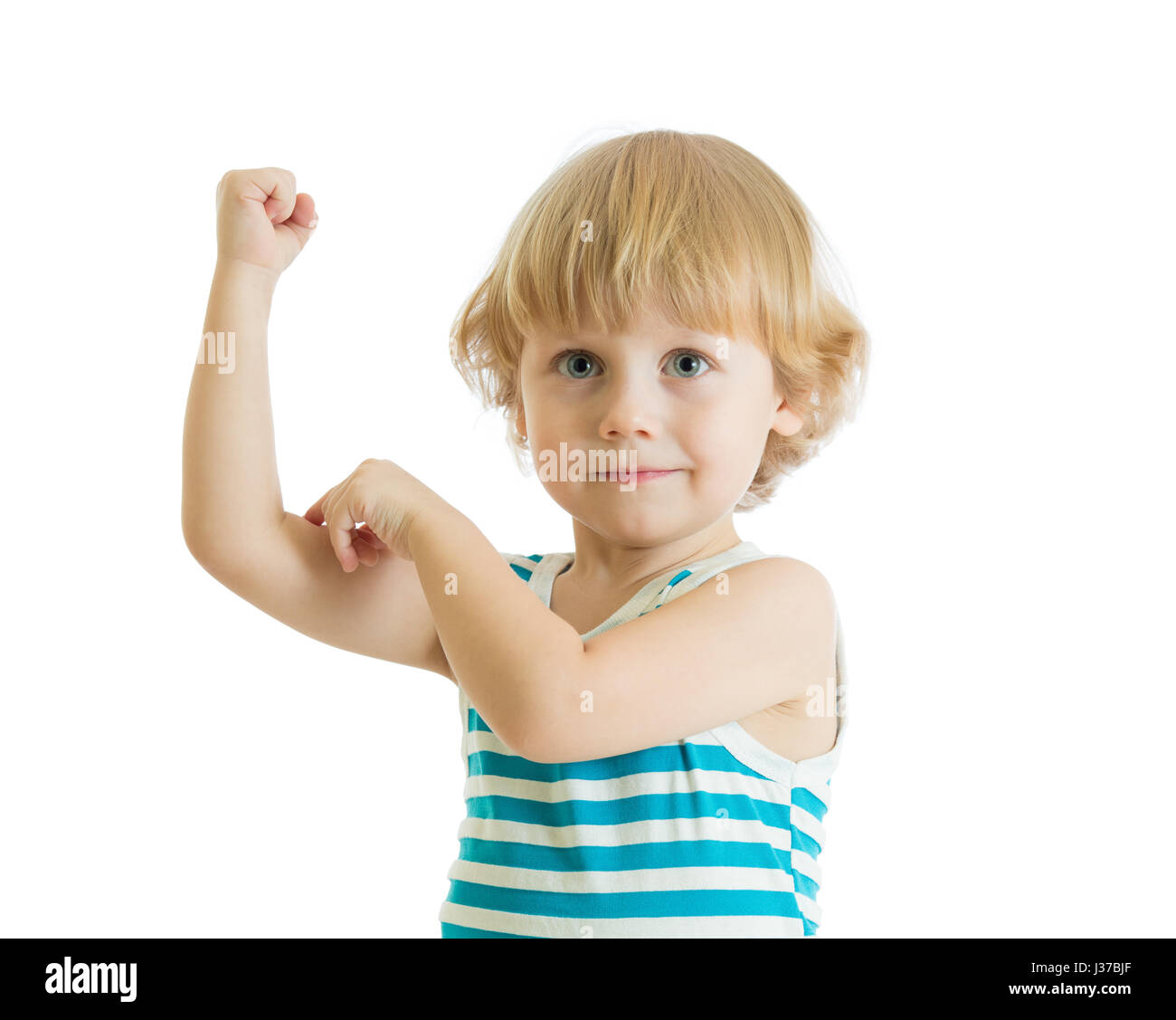 Kid boy child strength training and showing muscles. Stock Photo