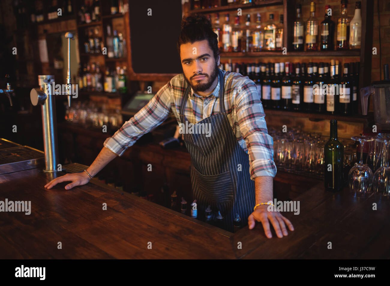 Portrait of waiter standing at counterÃ‚Â in pub Stock Photo - Alamy