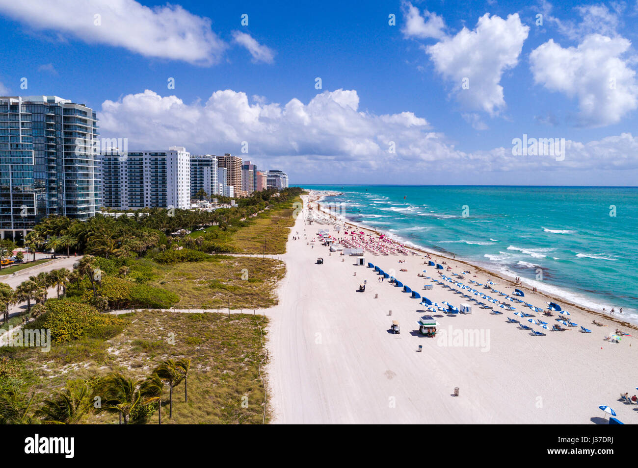 Miami Beach Florida,sand,Atlantic Ocean,surf,aerial overhead view,lounge chairs,cabanas,high rise condominium buildings,hotels,FL170429d04 Stock Photo