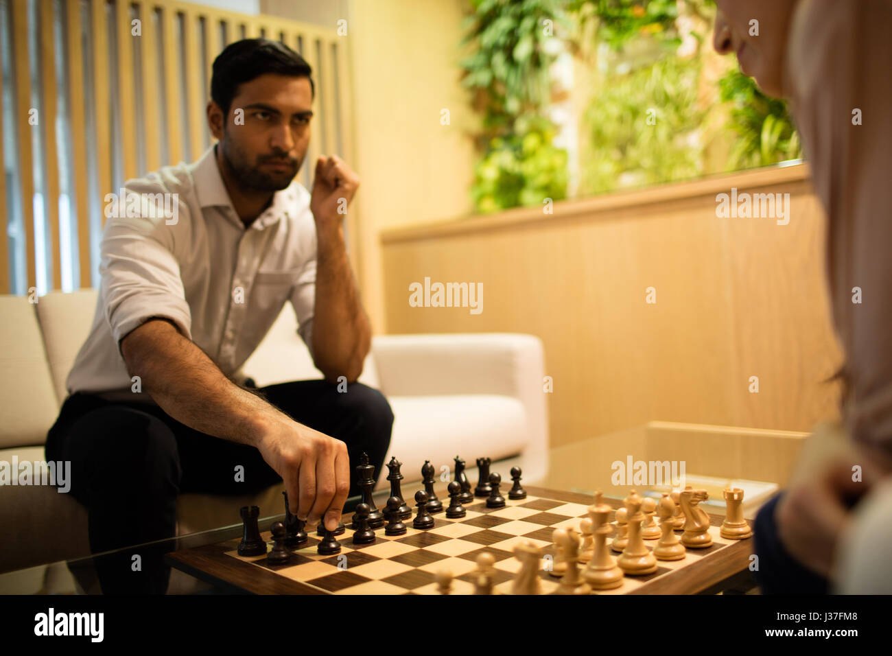 Colleagues playing chess hi-res stock photography and images - Alamy