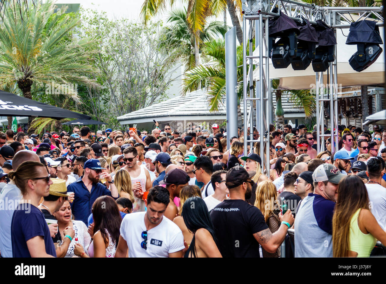 Miami Beach Florida,Miami Music Week,pool party,crowd,standing,dancing,drink  drinks beverage beverages drinking,young adult,men,women,stage,lighting,t  Stock Photo - Alamy