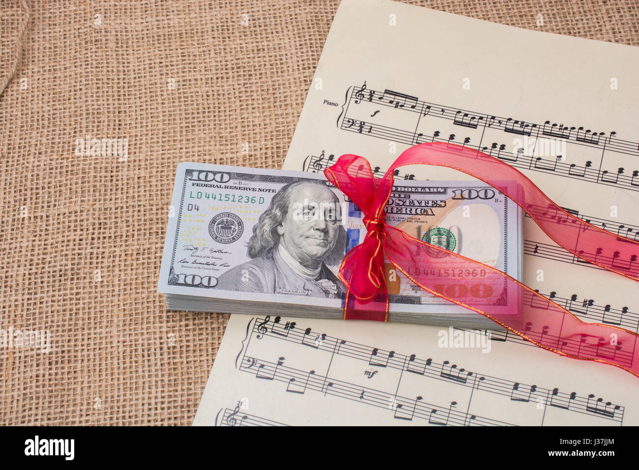 Bank Notes Ribbons Banknote bundle of US dollar tied with colorful a ribbon Stock Photo ...