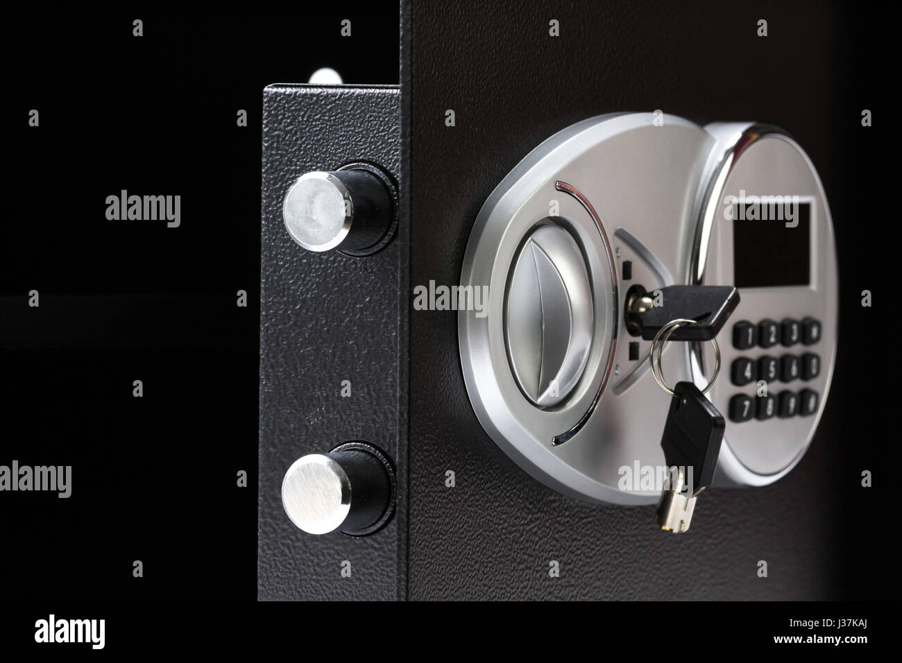 Opened black metal safe box with numeric keypad locked system, closeup