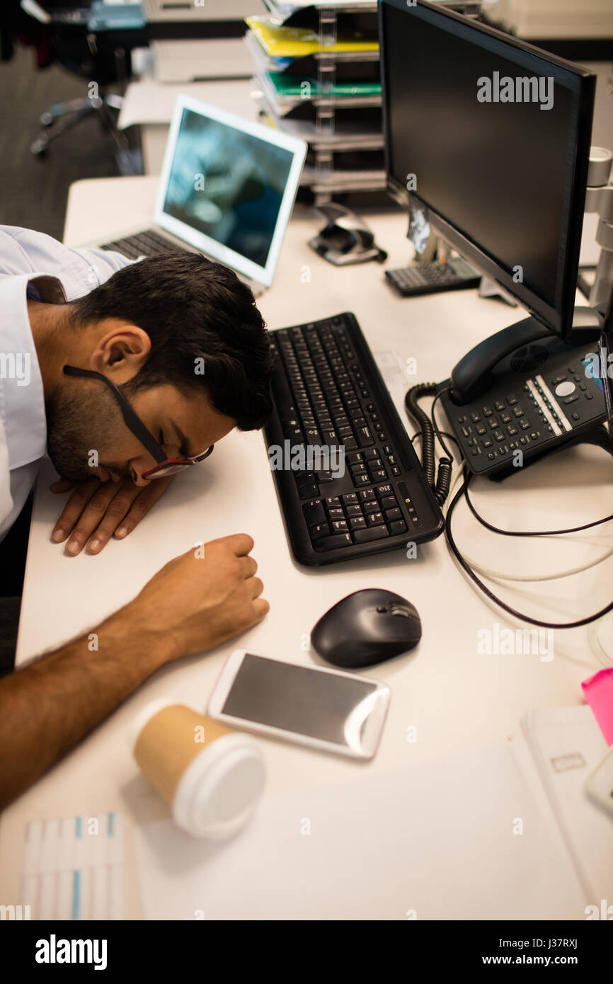 Asian man sleeping at desk hi-res stock photography and images - Alamy