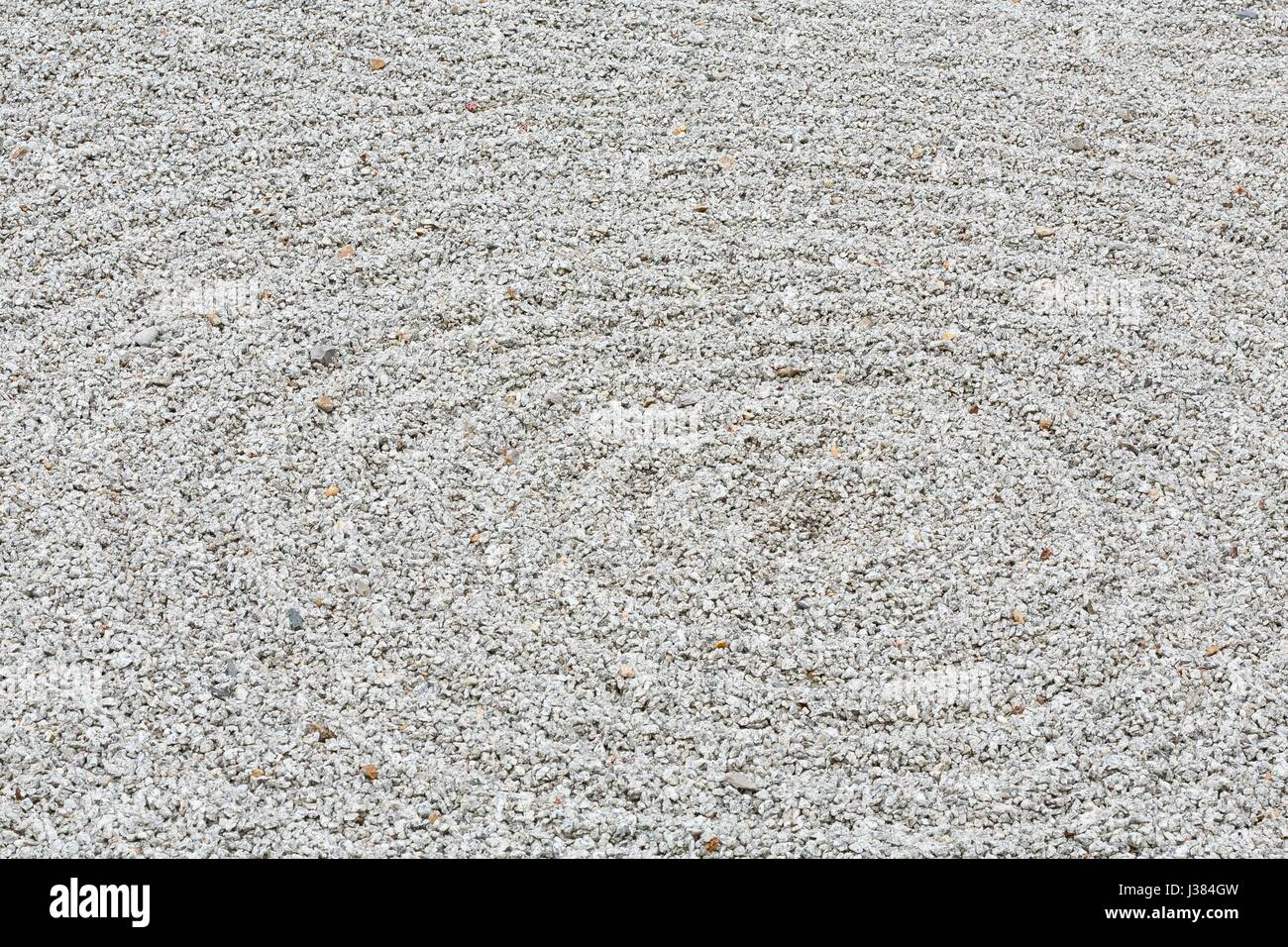Circular raked gravel pattern in a zen garden Stock Photo Alamy