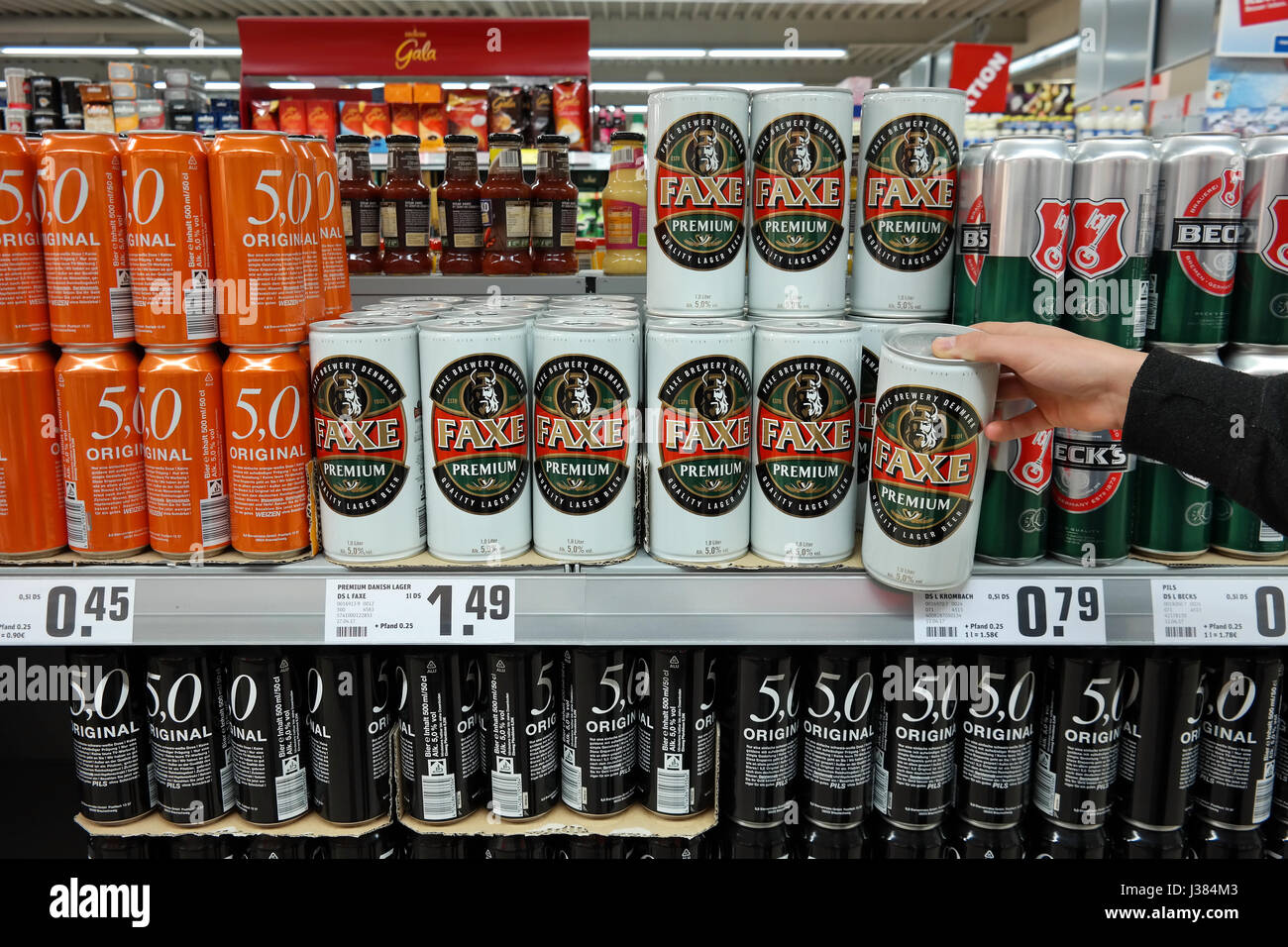 Faxe Premium lager beer cans in a supermarket Stock Photo - Alamy