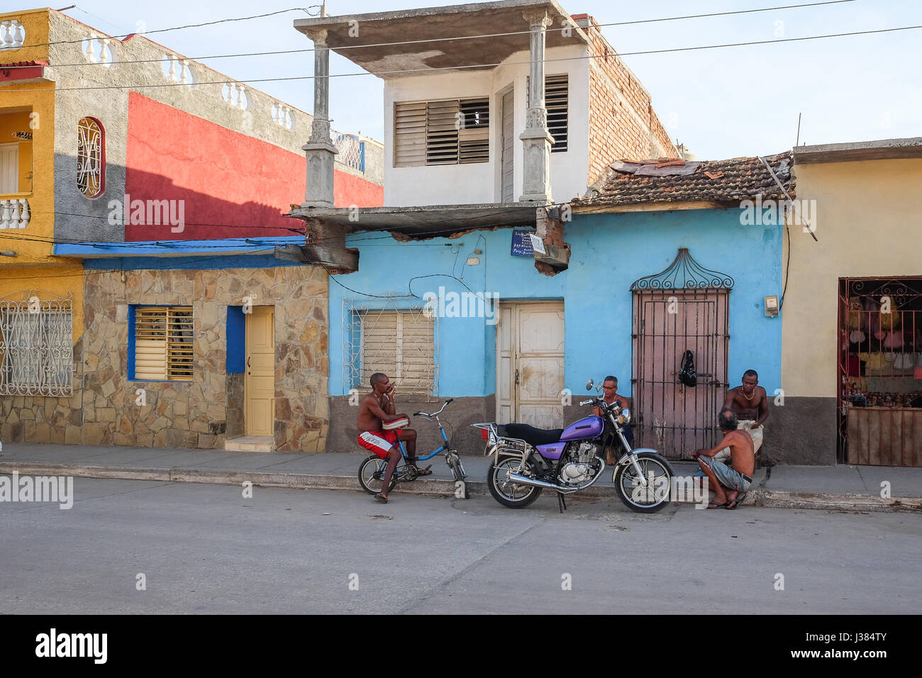 Local street life in Trinidad, Sancti Spiritus, Cuba. Local cubans gathering together after work. Stock Photo