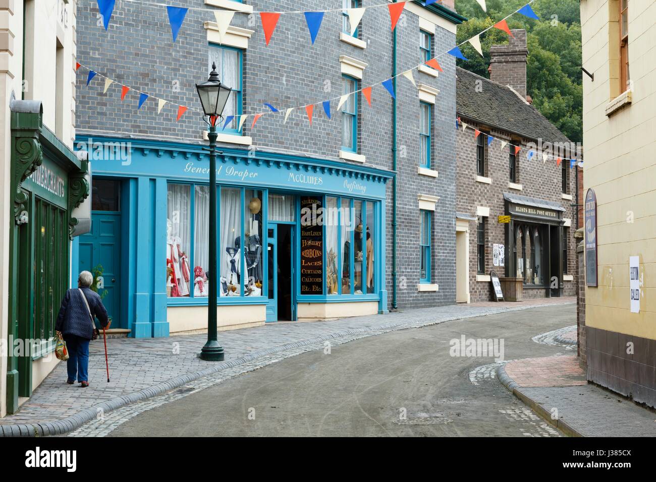 Traditional victorian town shops along a historic street in Blists Hill Museum, Ironbridge, Shropshire, UK Stock Photo