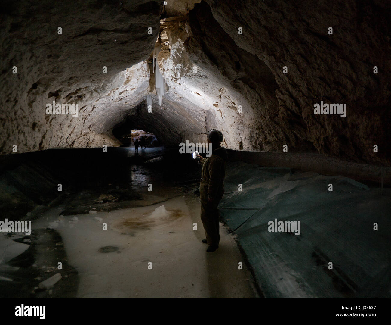 Girl speleologist. Cave in the Pinega region .Arhangelsk region Stock Photo