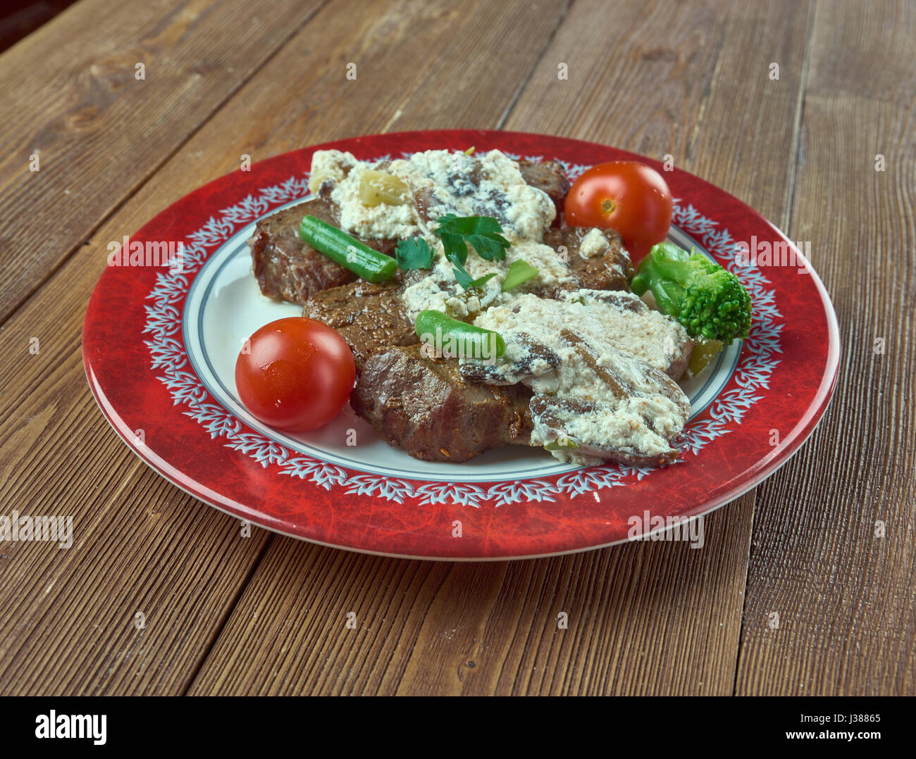 Veal Oscar - dish consists of sauteed veal cutlets topped with crab or