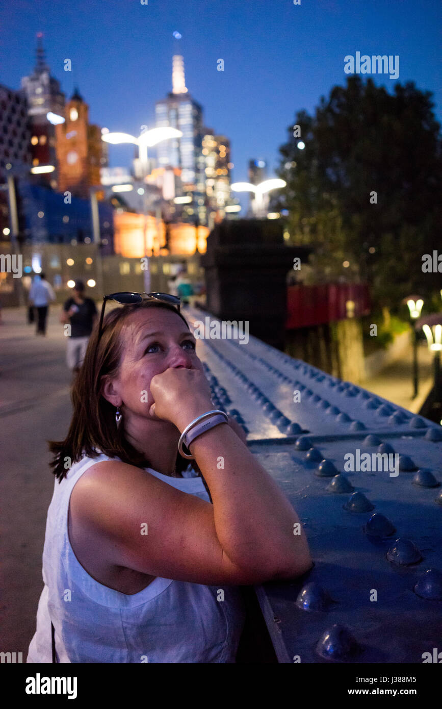 Female looking at the city skyline in Melbourne Australia Stock Photo