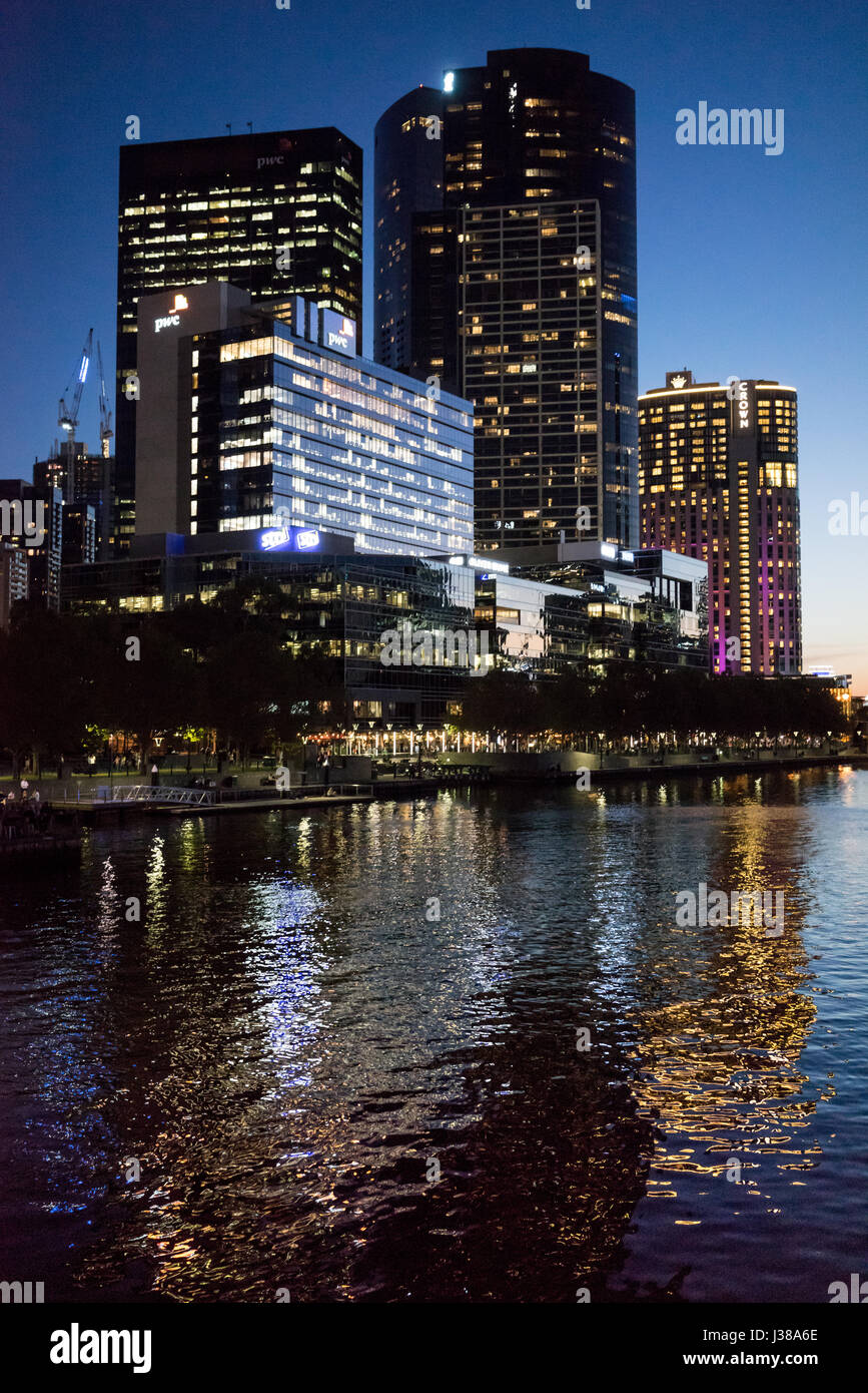 Across the Yarra river in Melbourne Australia at night with highrise buildings Stock Photo