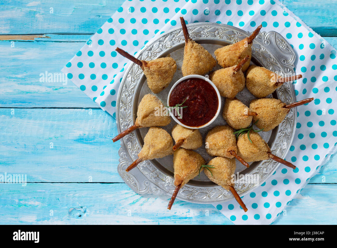 Snack spicy fried quail legs, cutlet in a batter with breaded on the kitchen table. Fast food