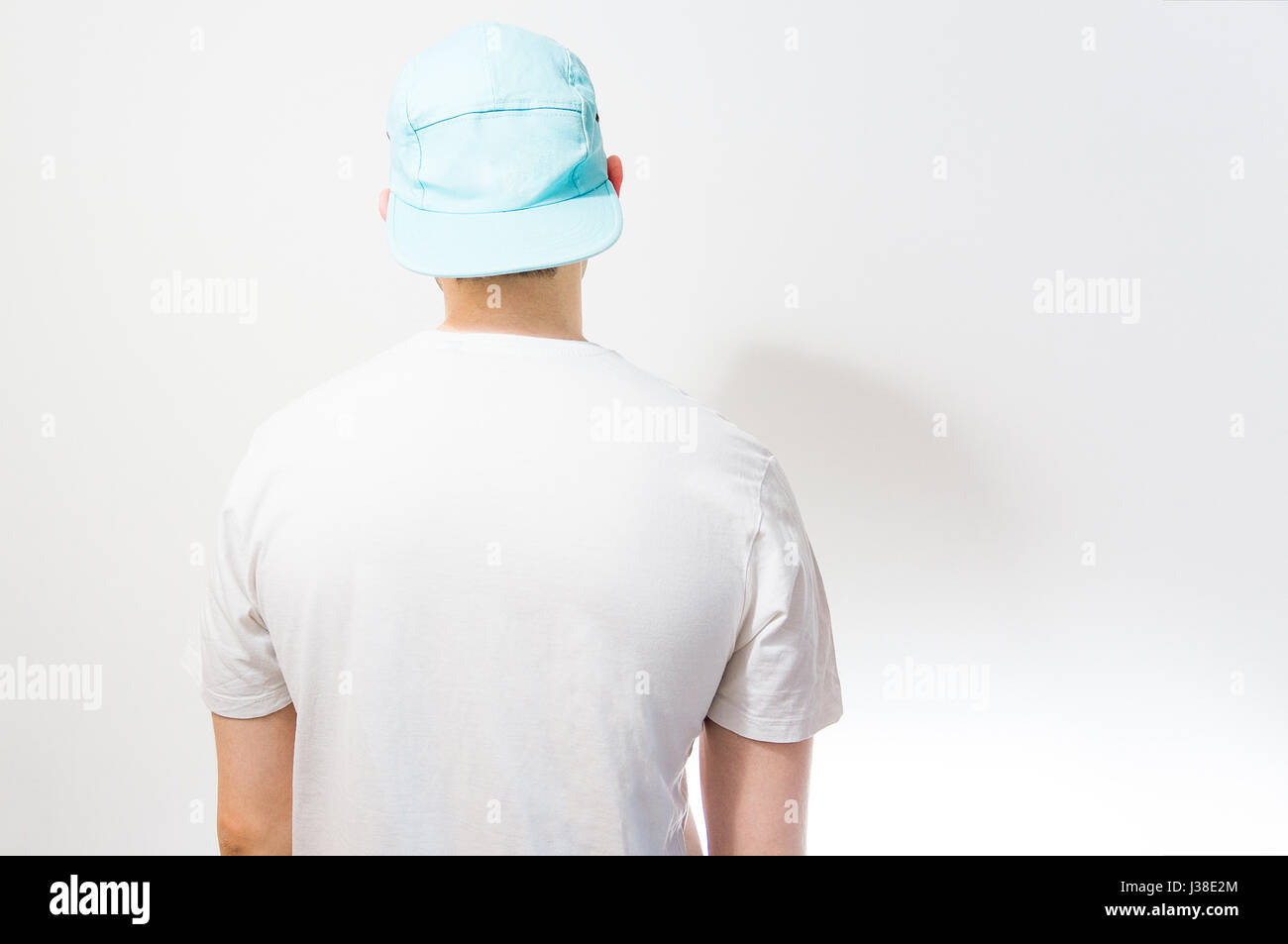 The Man Guy In The Blank White Turquoise Baseball Cap On A White