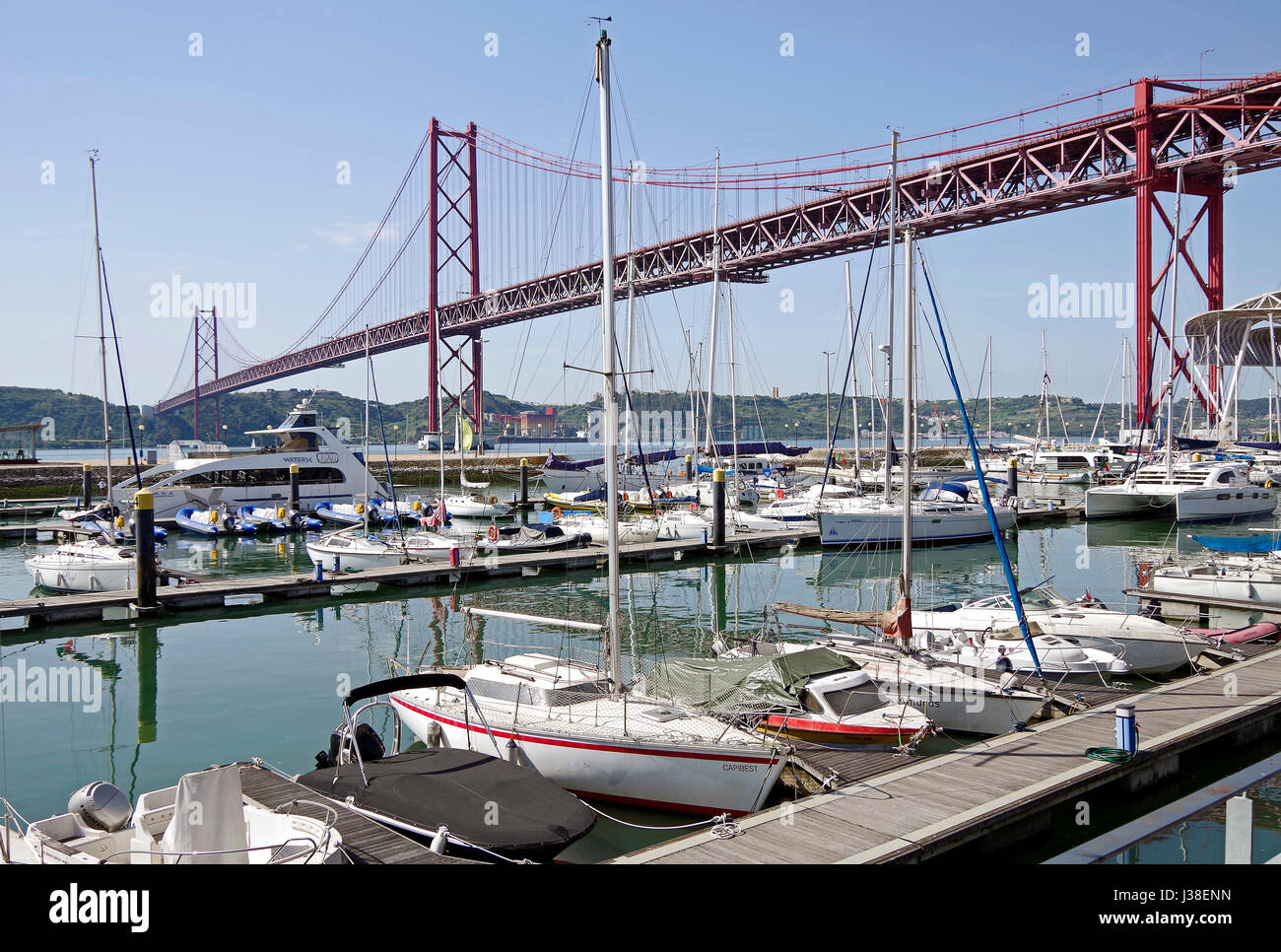 The 25 de Abril suspension bridge, across the River Tagus,  approximately ,6kms south-west of downtown Lisbon, Portugal. Stock Photo