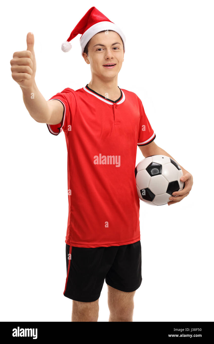 Teenage soccer player with a christmas hat making a thumb up sign