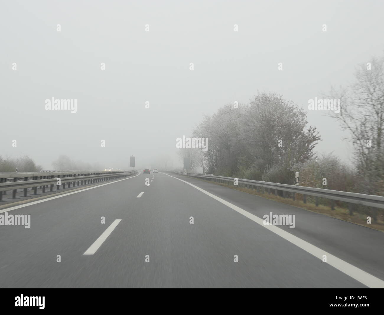 Highway in fog German Autobahn Stock Photo