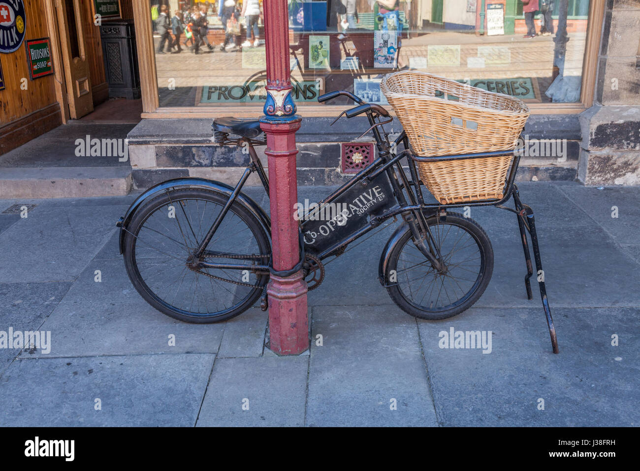 The Cooperative Society 's delivery bike parked outside the shop at  Beamish Museum,Co.Durham,England,UK Stock Photo