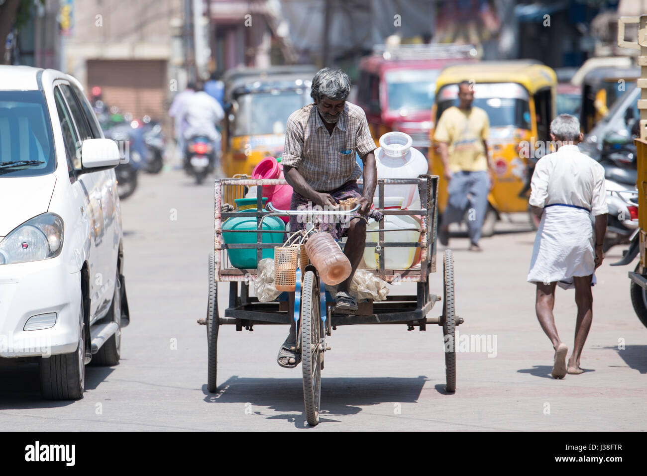 Man transporting goods on a Rikshaw in Madurai, India Stock Photo