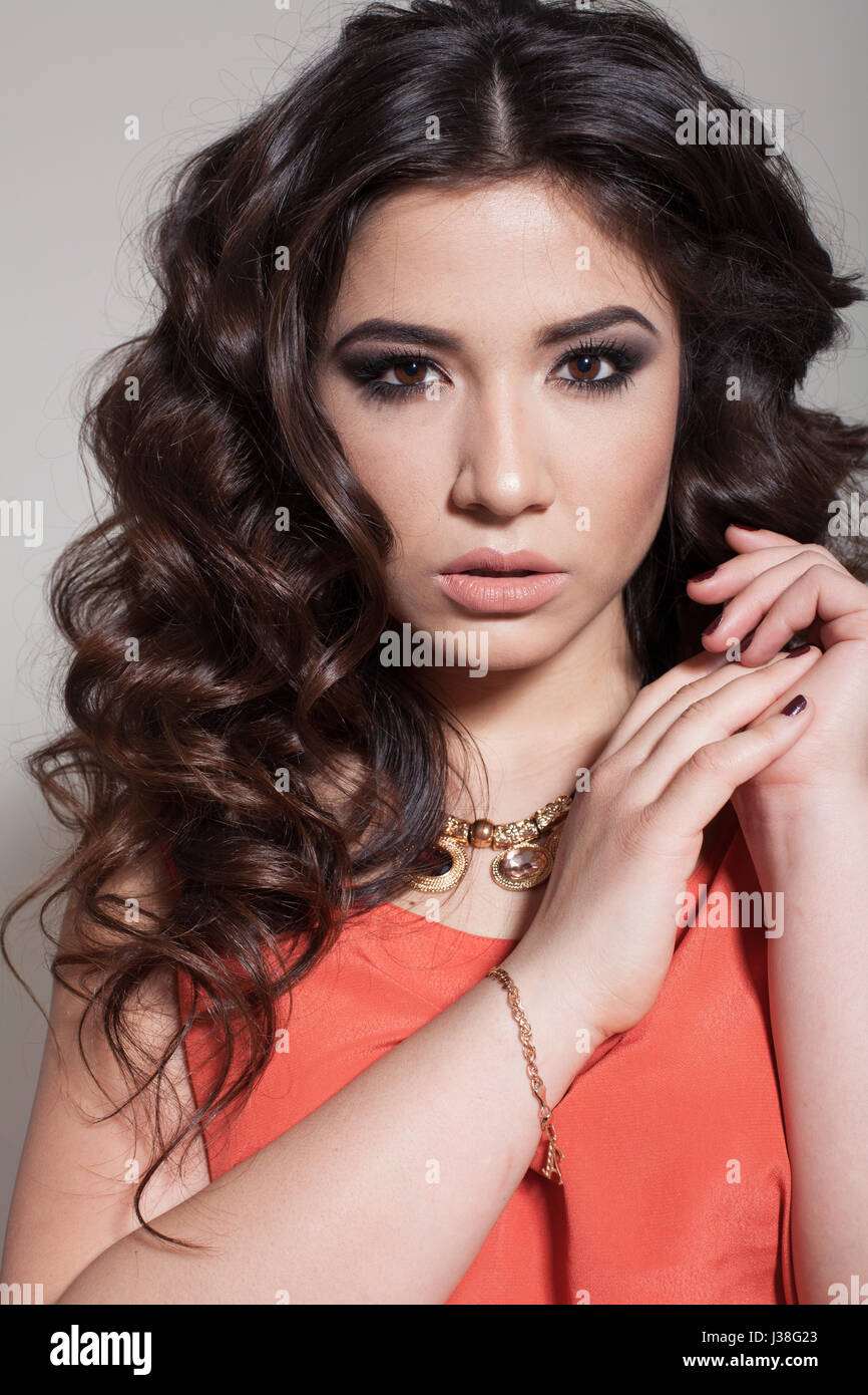girl posing curls hairstyle business style Stock Photo - Alamy