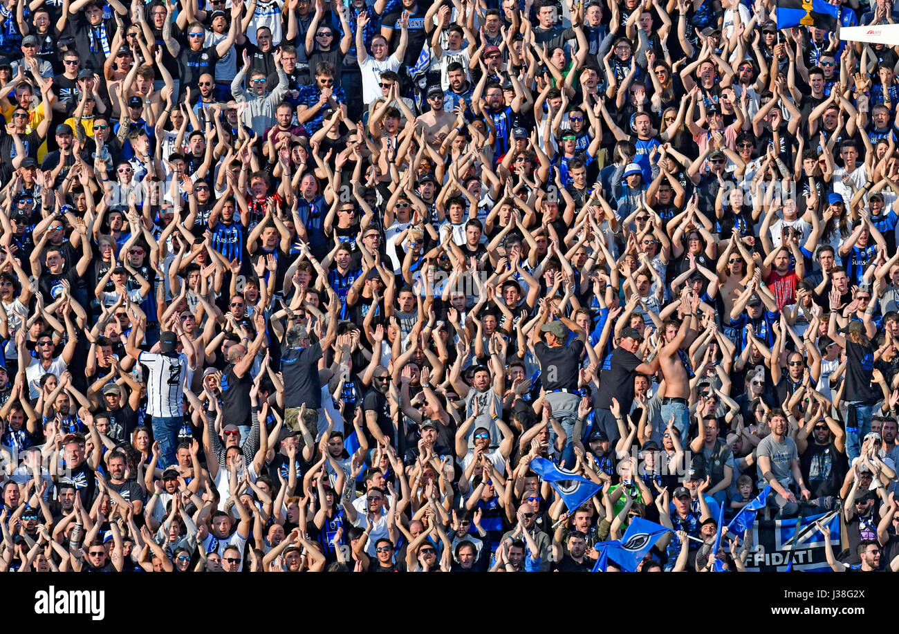 Atalanta's football fans cheering at the stadium, in Bergamo, Italy. Stock Photo