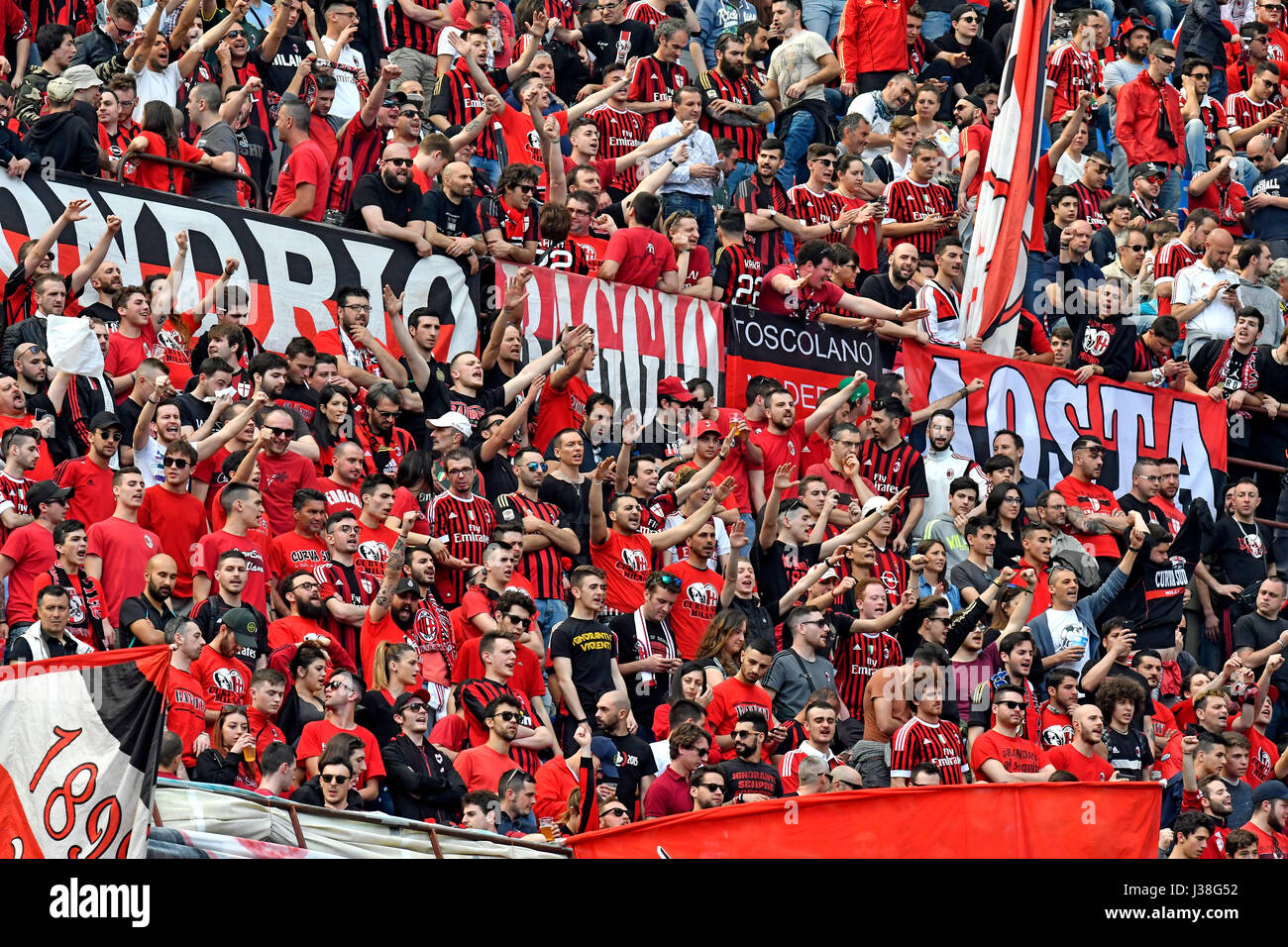 AC Milan's fans cheering at the San siro football stadium, in Milan. Stock Photo