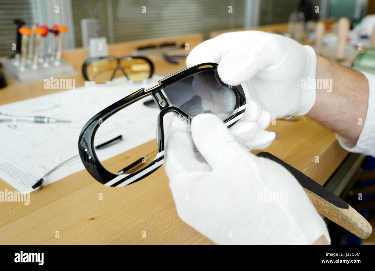 Eyeglasses and sunglasses's prototype  on work table at Safilo italian factory, in Padova, Italy. Stock Photo