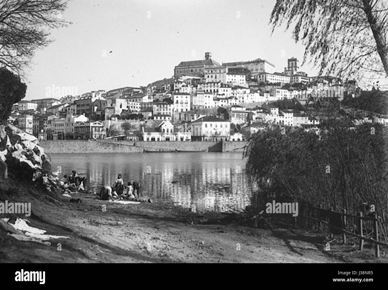 This title refers to a general view of the city of Coimbra in Portugal, with the Mondego River visible in the foreground. Coimbra is known for its historical university and cultural significance. Stock Photo