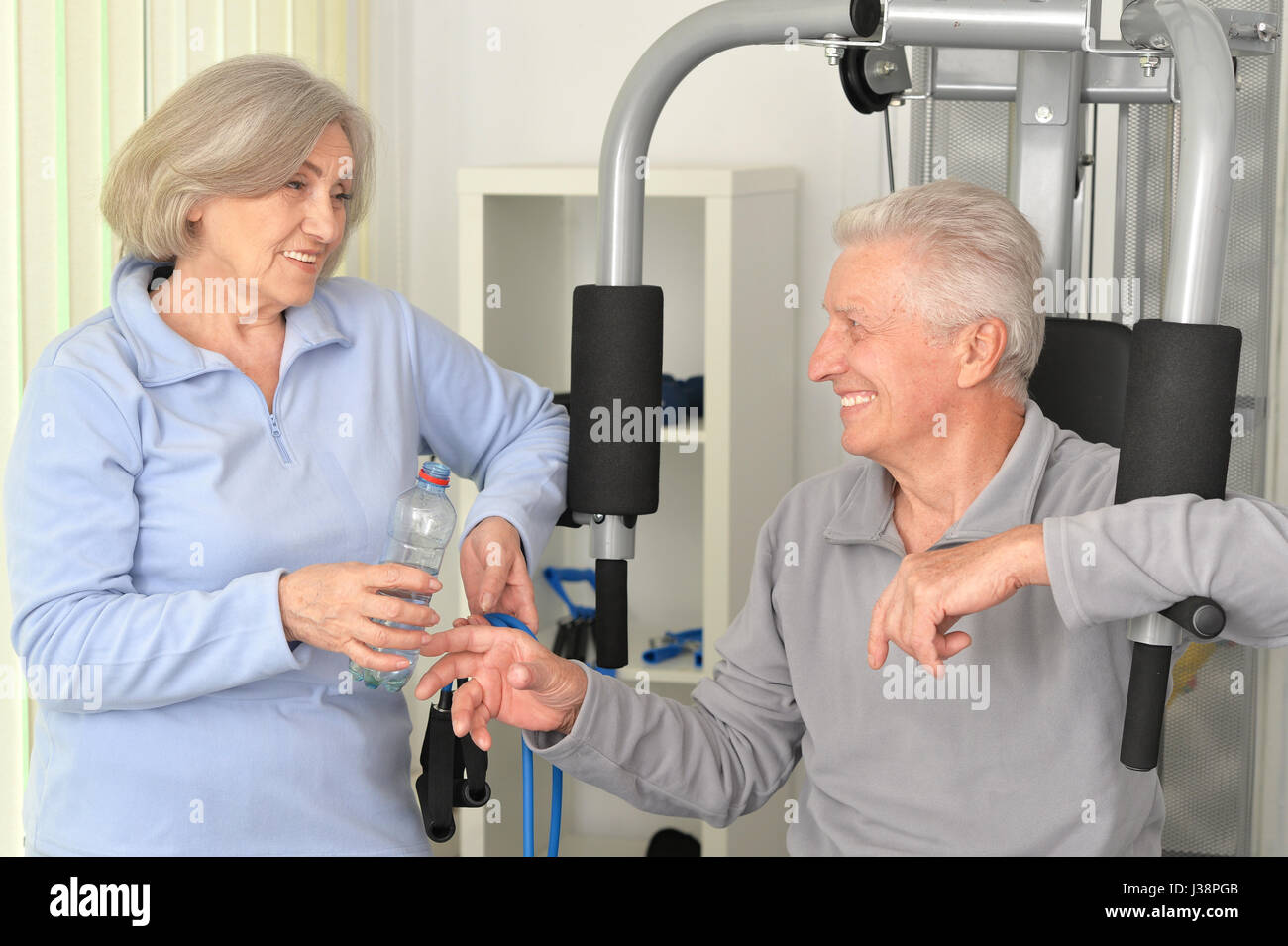 Beautiful elderly couple in a gym  Stock Photo