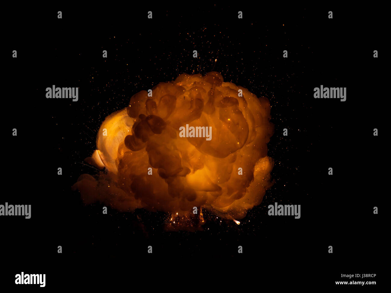 Realistic fiery explosion, orange color with sparks isolated on black ...