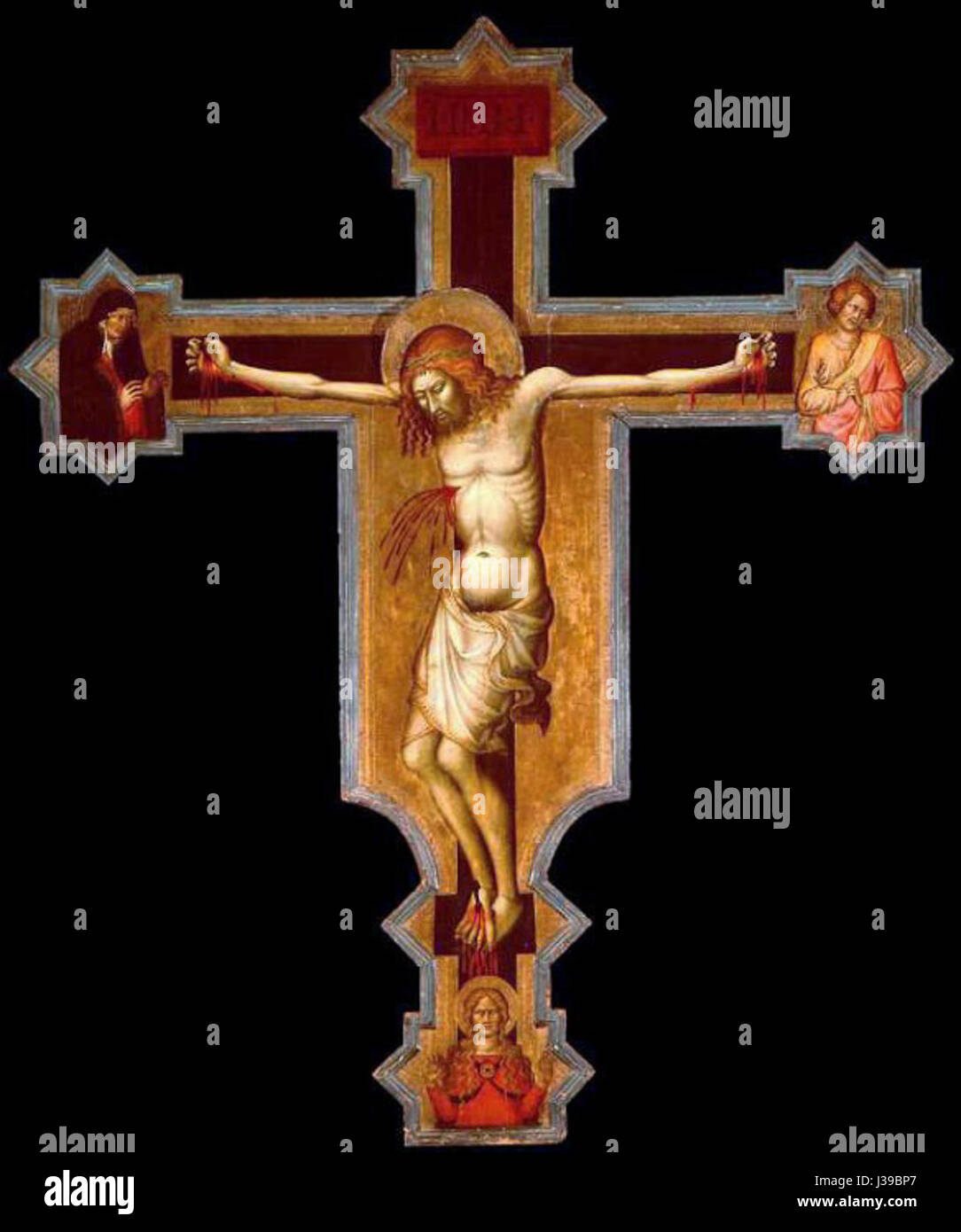 This 14th-century crucifix, displayed at the Bob Jones University Museum, is a historical religious artifact from the medieval period. Stock Photo