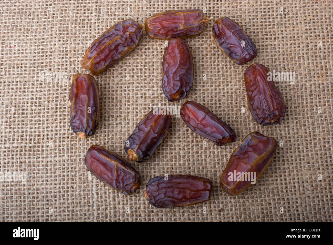date-fruit-form-a-circle-shape-on-canvas-background-stock-photo-alamy