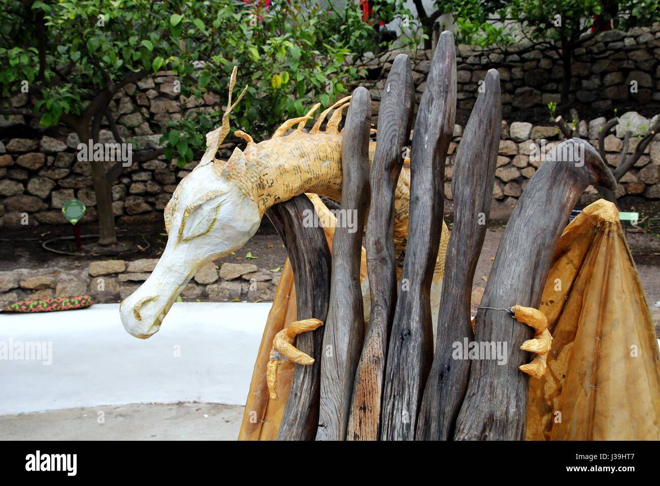 Bodelva, Cornwall, UK - April 4 2017: The story telling chair with dragon at the Eden Project in Cornwall England Stock Photo