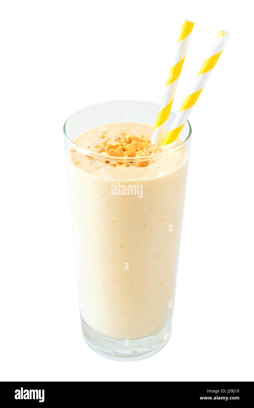 Peanut butter banana oat breakfast smoothie with paper straws isolated on a white background Stock Photo