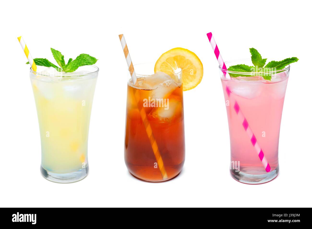 Three glasses of summer lemonade, iced tea, and pink lemonade drinks with straws isolated on a white background Stock Photo