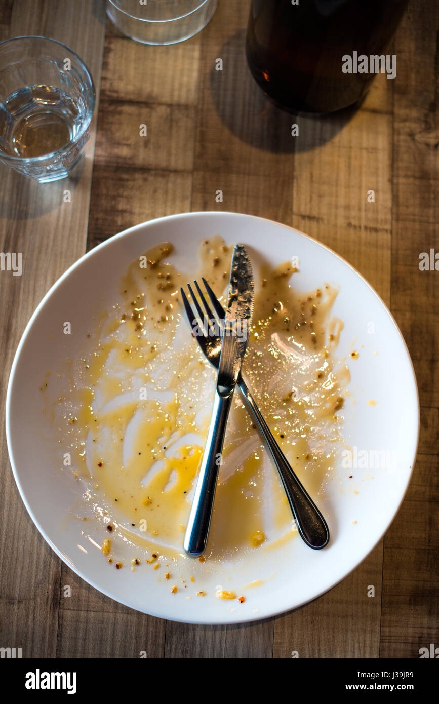 empty plate left after dinner Stock Photo Alamy