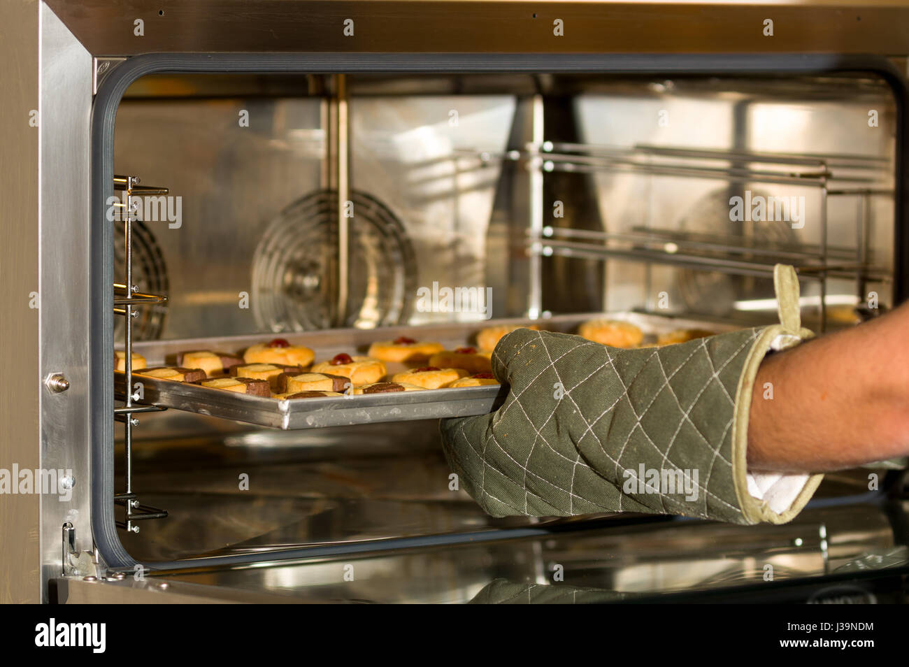 Delicious cookies in a tray put inside of a modern and useful