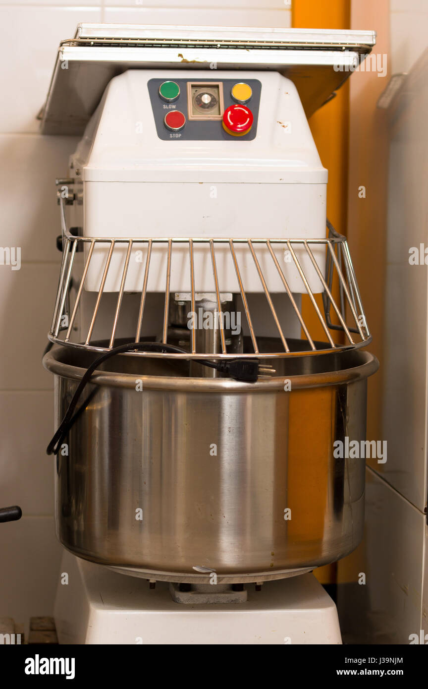 Bread Mixer In Bakery, mixing dough for baguettes in a bakery machine for  mixing dough Stock Photo - Alamy