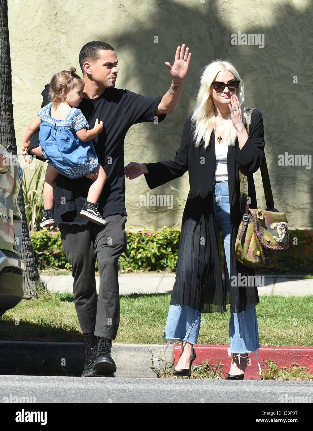 Ashlee Simpson and Evan Ross cross Ventura Boulevard with their