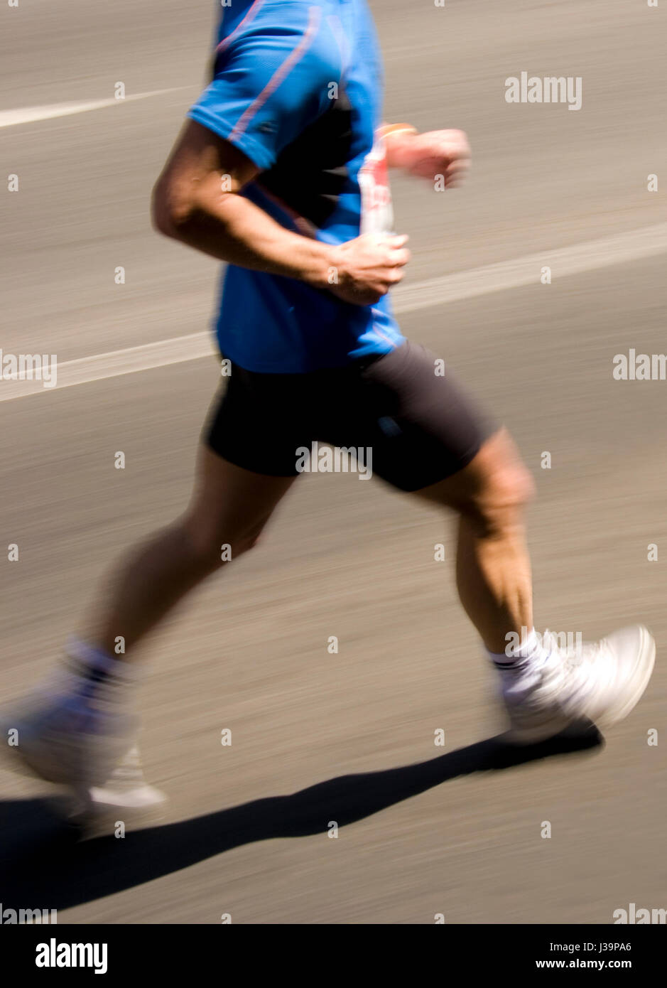 legs of a marathon runner Stock Photo