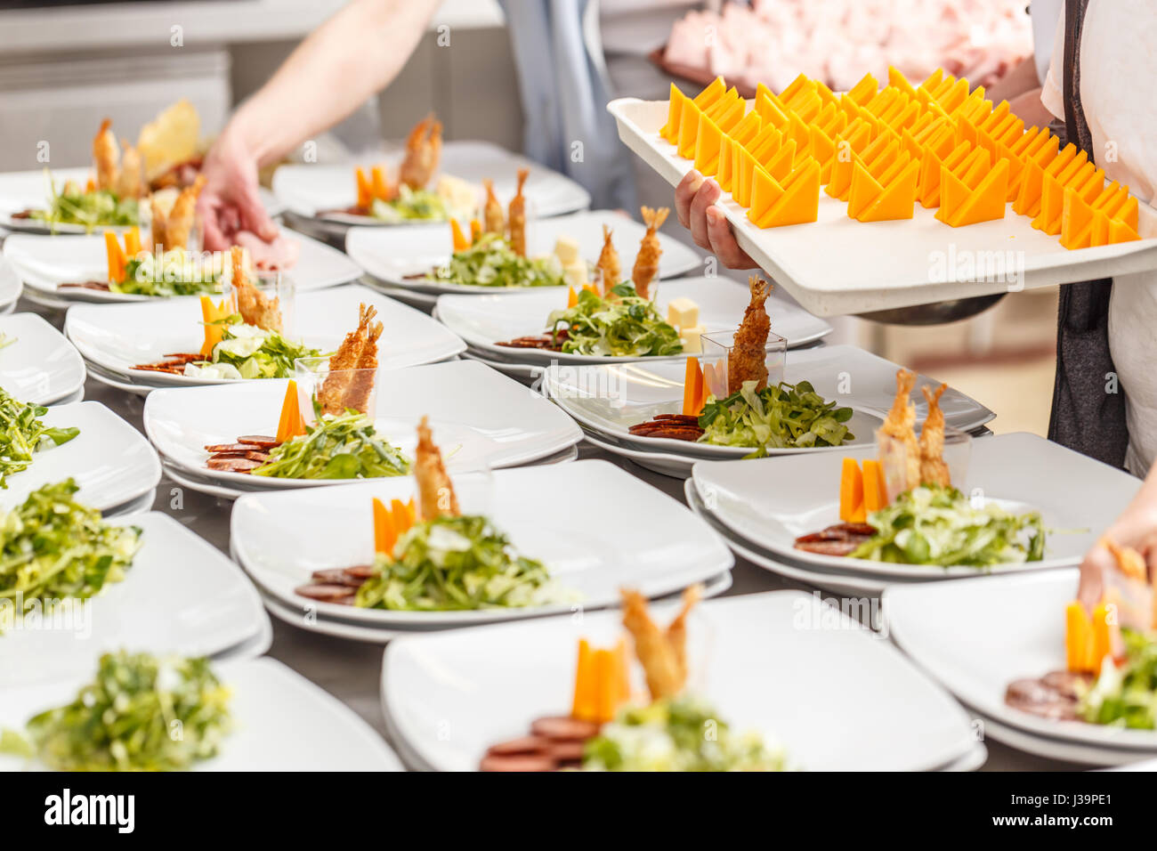 Cook prepare appetizer dishes at gourmet restaurant Stock Photo Alamy