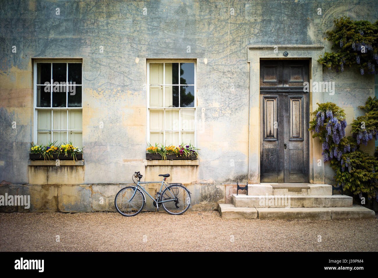 Student bikes parked outside student accommodation in Downing College, part of the University of Cambridge Stock Photo