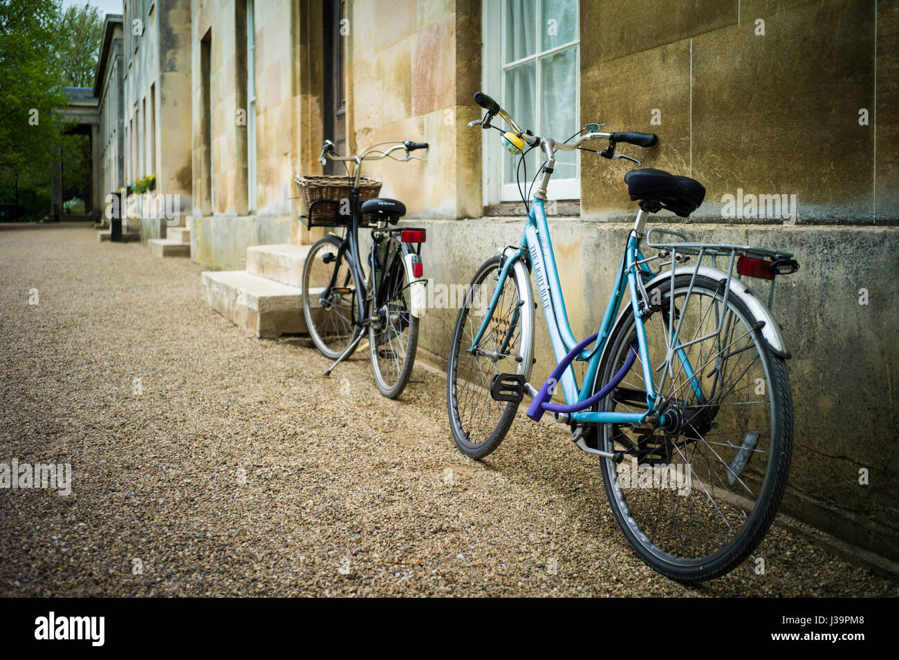 Student bikes parked outside student accommodation in Downing College, part of the University of Cambridge Stock Photo