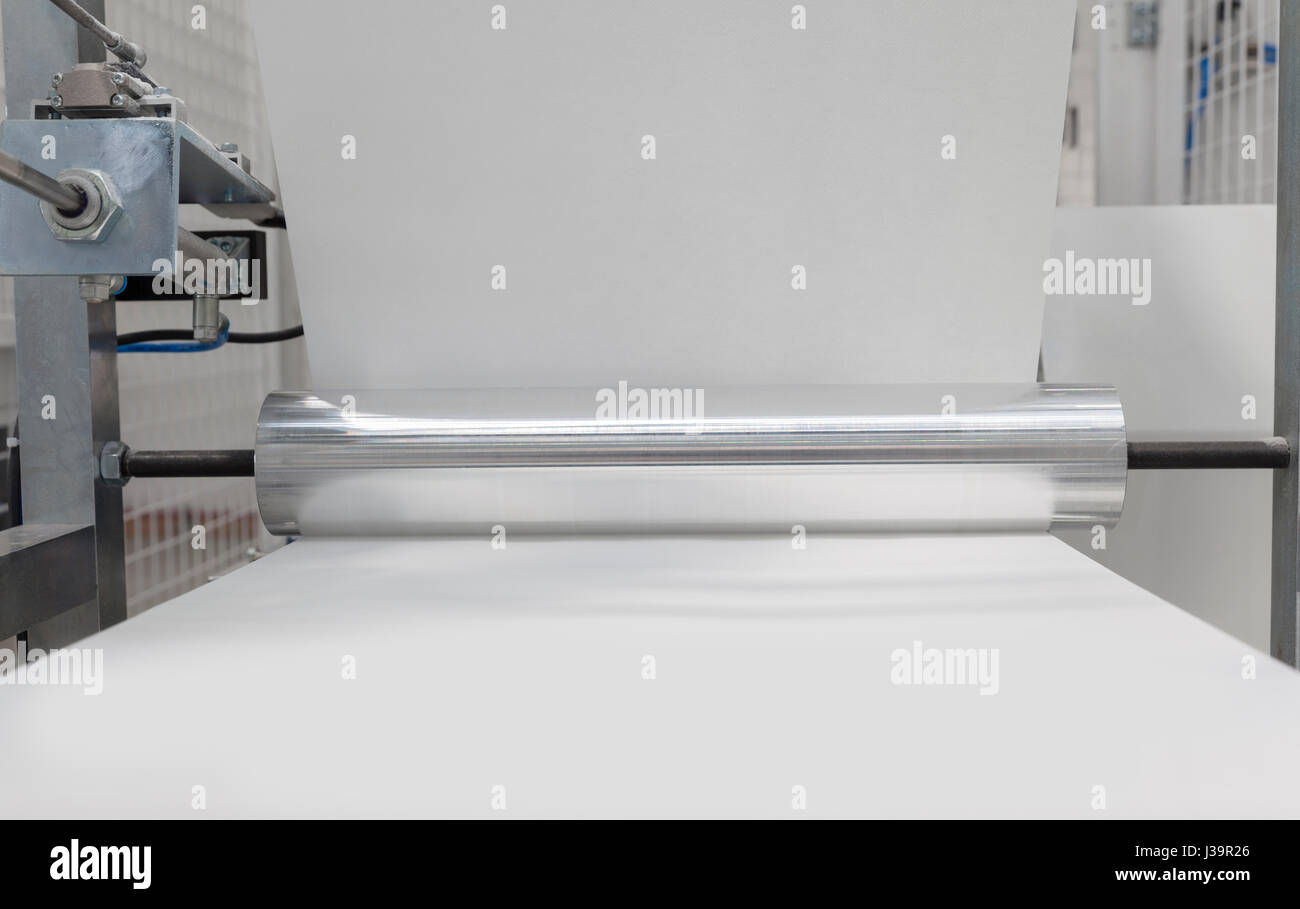 paper rolling machine, white paper on roll Stock Photo Alamy