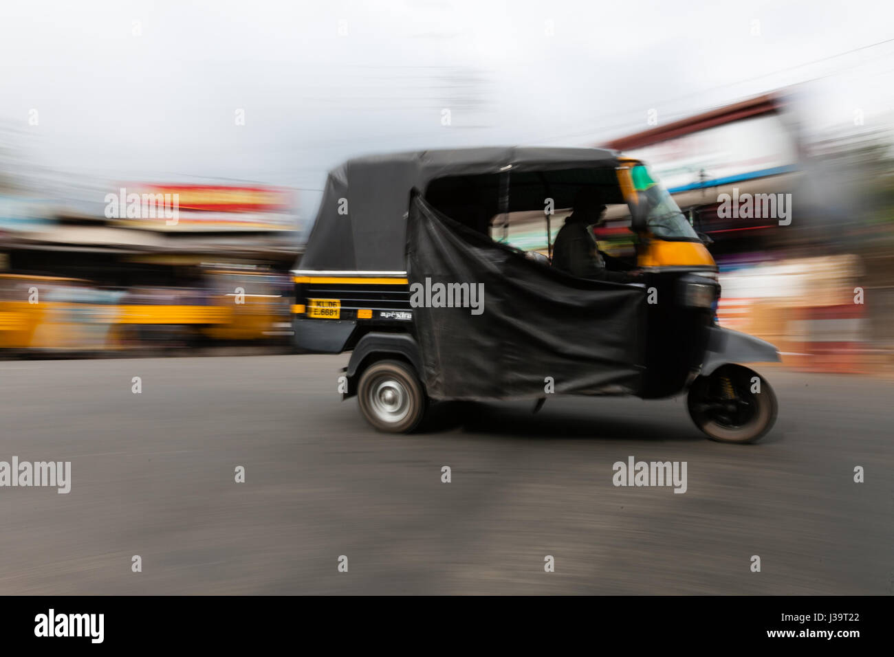 Speedy rickshaws tuk tuks showing movement blur Stock Photo - Alamy